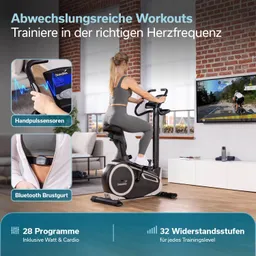 Fitnessgerät in Schwarz und Silber, mit einem integrierten Handpulssensor und einem Brustgurt. Auszeichnungen im Hintergrund sichtbar.