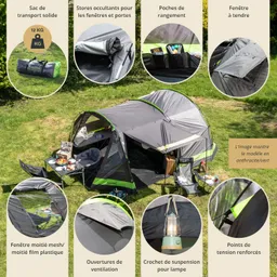 Zelt in anthrazit/Grün auf Rasen, mit Stauraum, Fenstern, Ventilationsöffnungen, und einer Lampe. Transporttasche daneben.