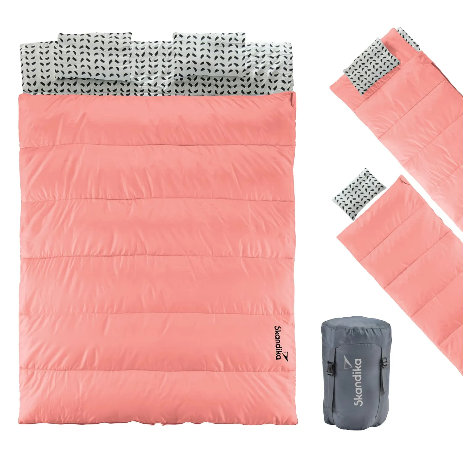 Schlafsack in rosa mit grauem Innenfutter und einem Muster. Dazu zwei separate Kopfkissen und eine graue Packtasche.