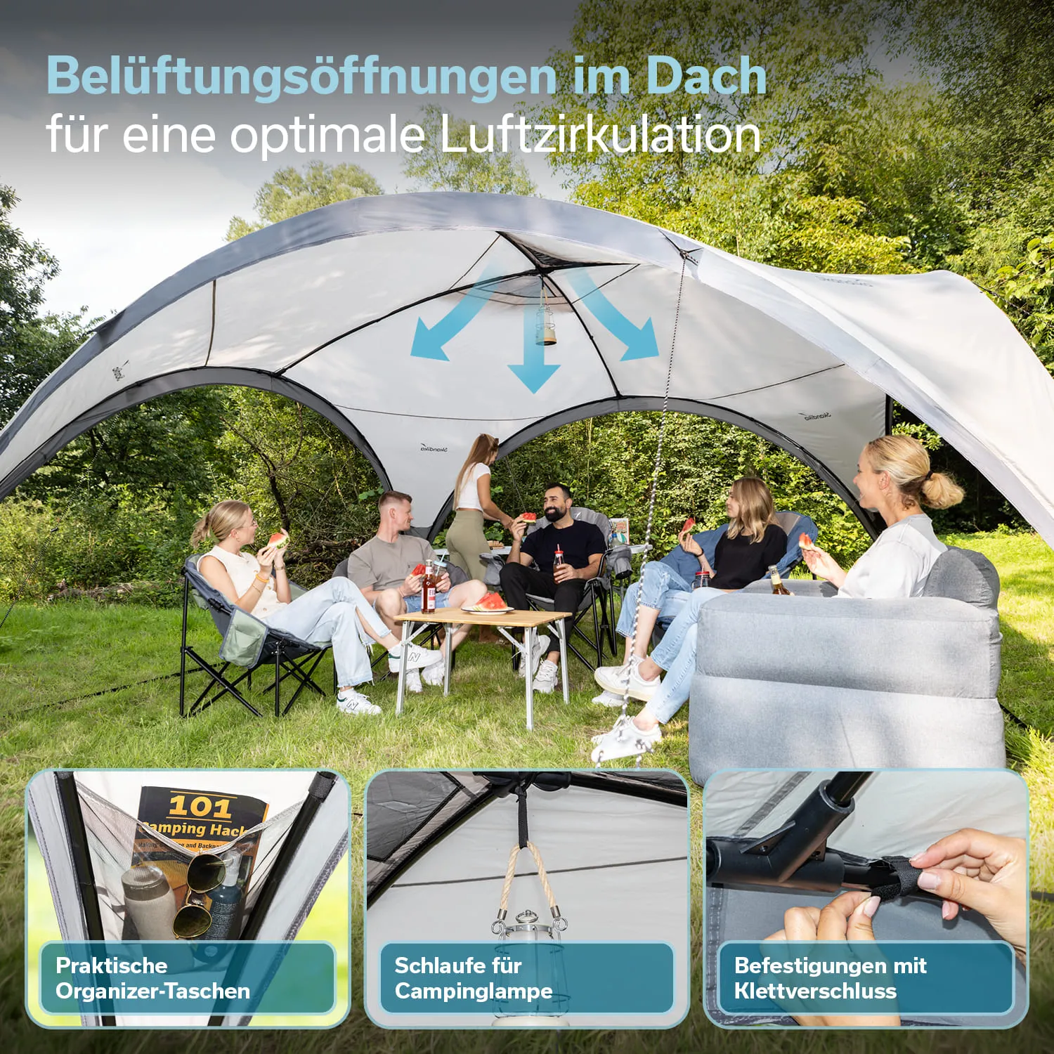 Grosser, halbrunder Pavillon mit Belüftungsöffnungen. Sechs Personen sitzen auf Stühlen, essen und trinken. Umgebung ist grün.