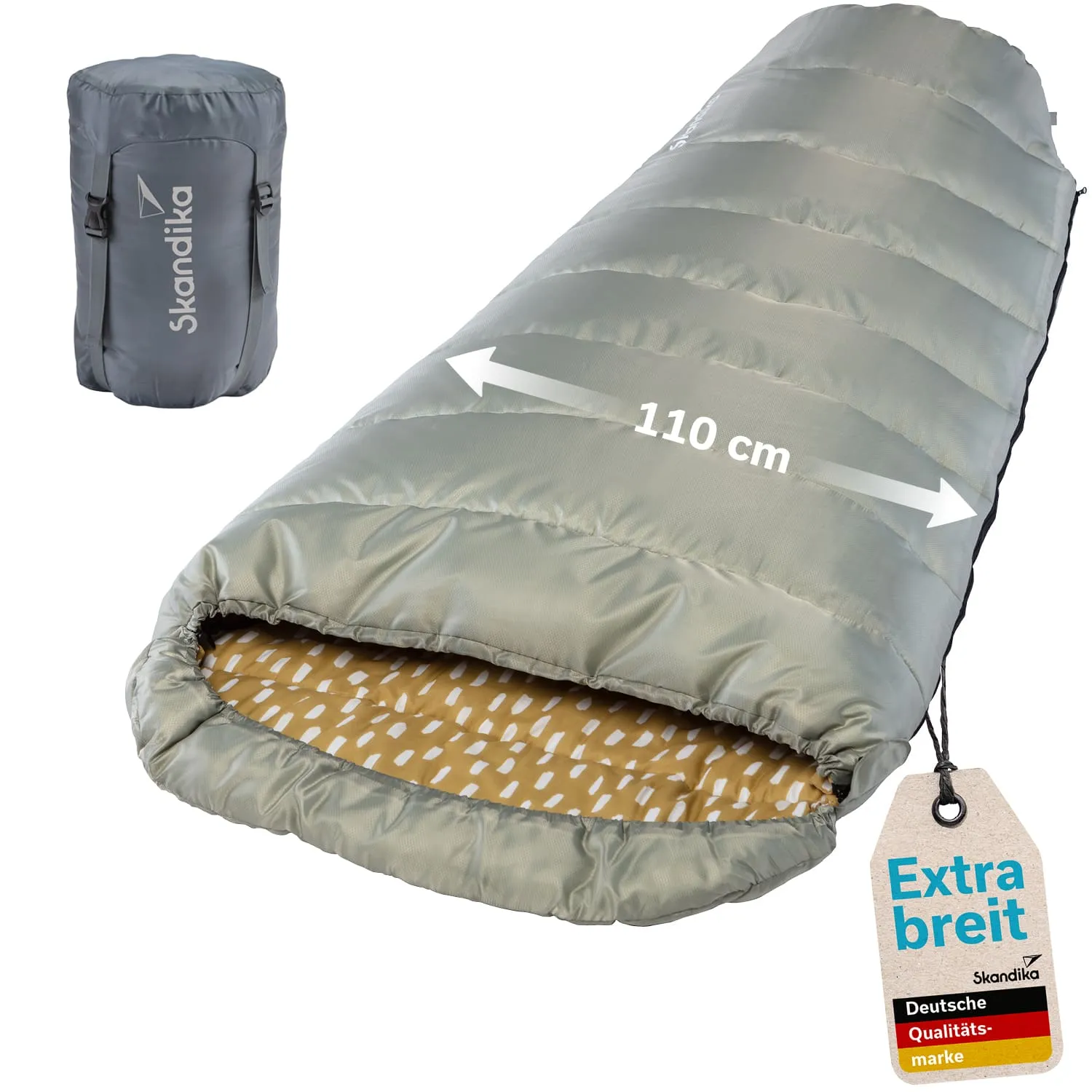 Schlafsack in grau mit Innenfutter in gelb und weißen Punkten, Maßangabe 110 cm, daneben komprimierter Packsack.