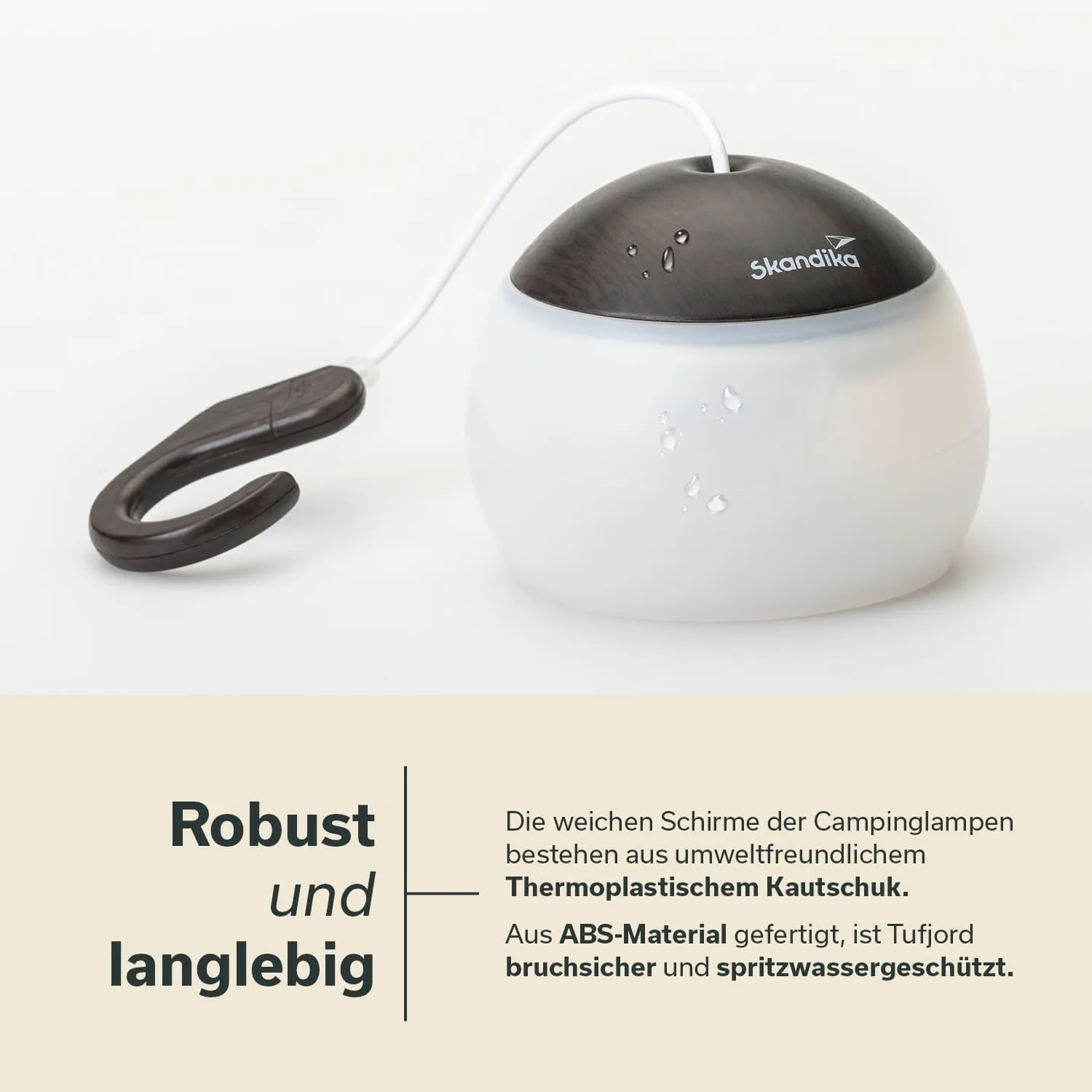 Campinglampe mit einem runden, weißen Kunststoffkörper und einem braunen, abgerundeten oberen Teil. Ein Haken ist am Körper angebracht.