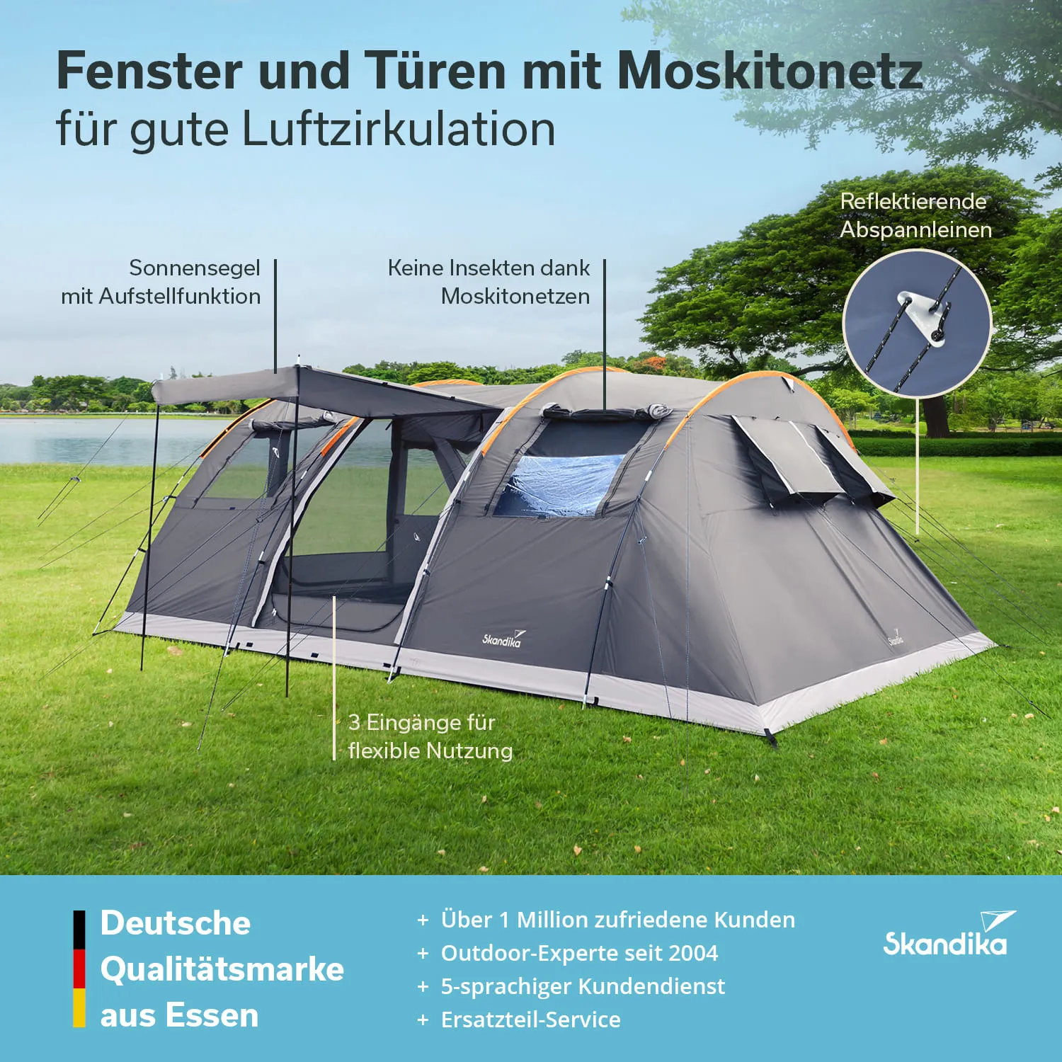 Zelt mit Moskitonetzen, Sonnensegel und reflektierenden Abspannleinen auf einer Wiese am Wasser. Klare, blaue Himmel.