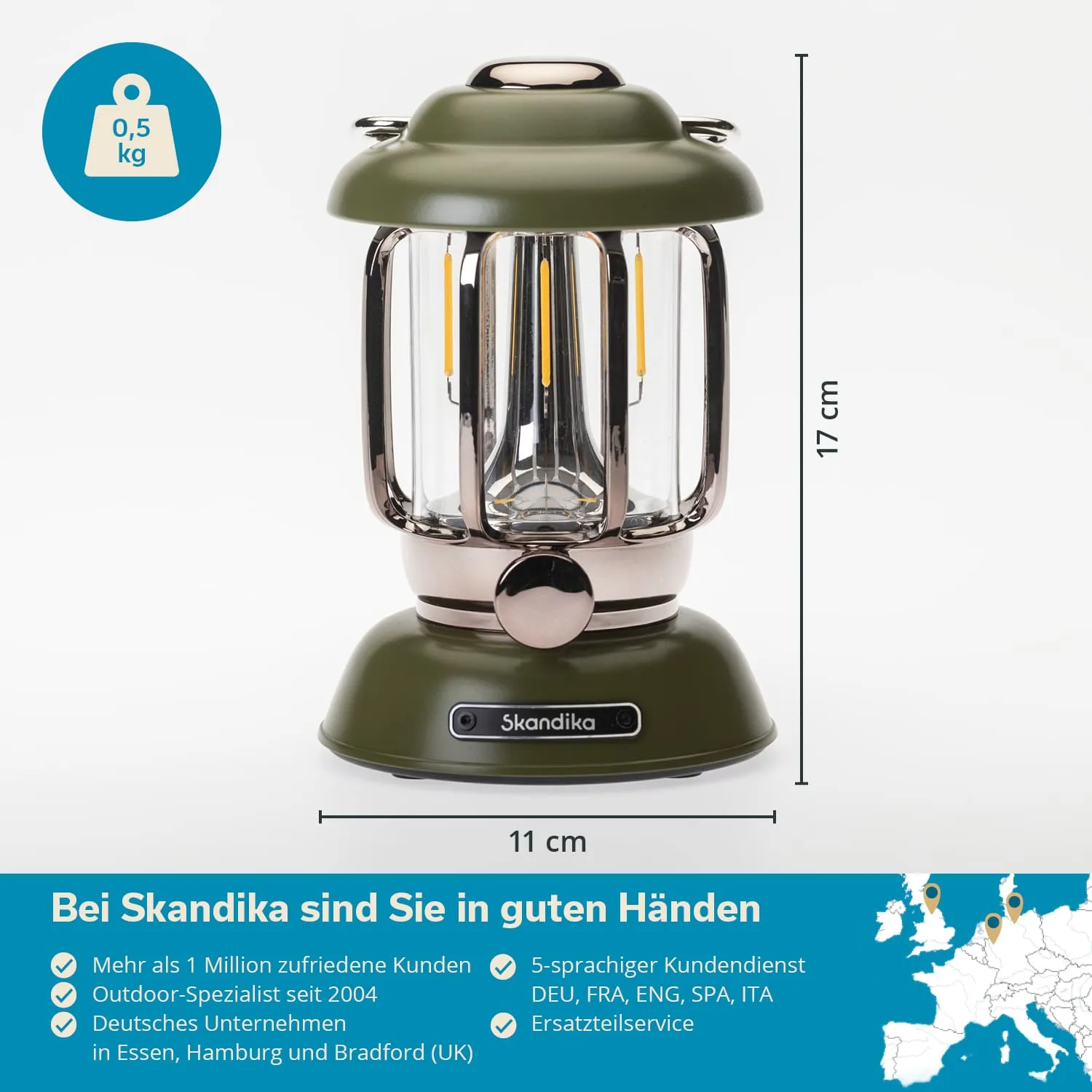 Grüne Laterne mit transparentem Glas und metallischen Details, Höhe 17 cm, Durchmesser 11 cm. Gewicht 0,5 kg.