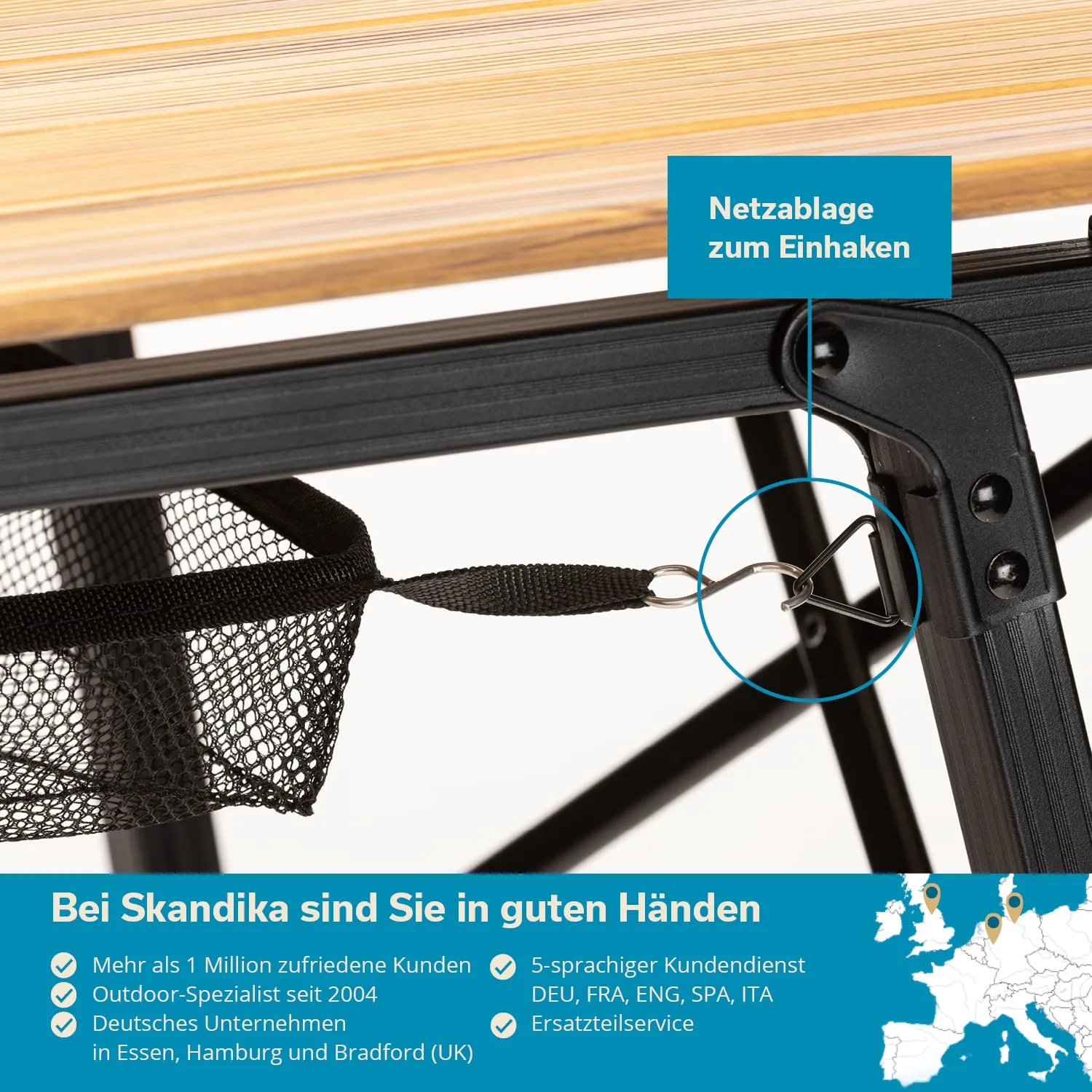Detailansicht eines Tischgestells mit einer schwarzen Netztasche, die zur Sicherung an einer Halterung eingehakt ist.