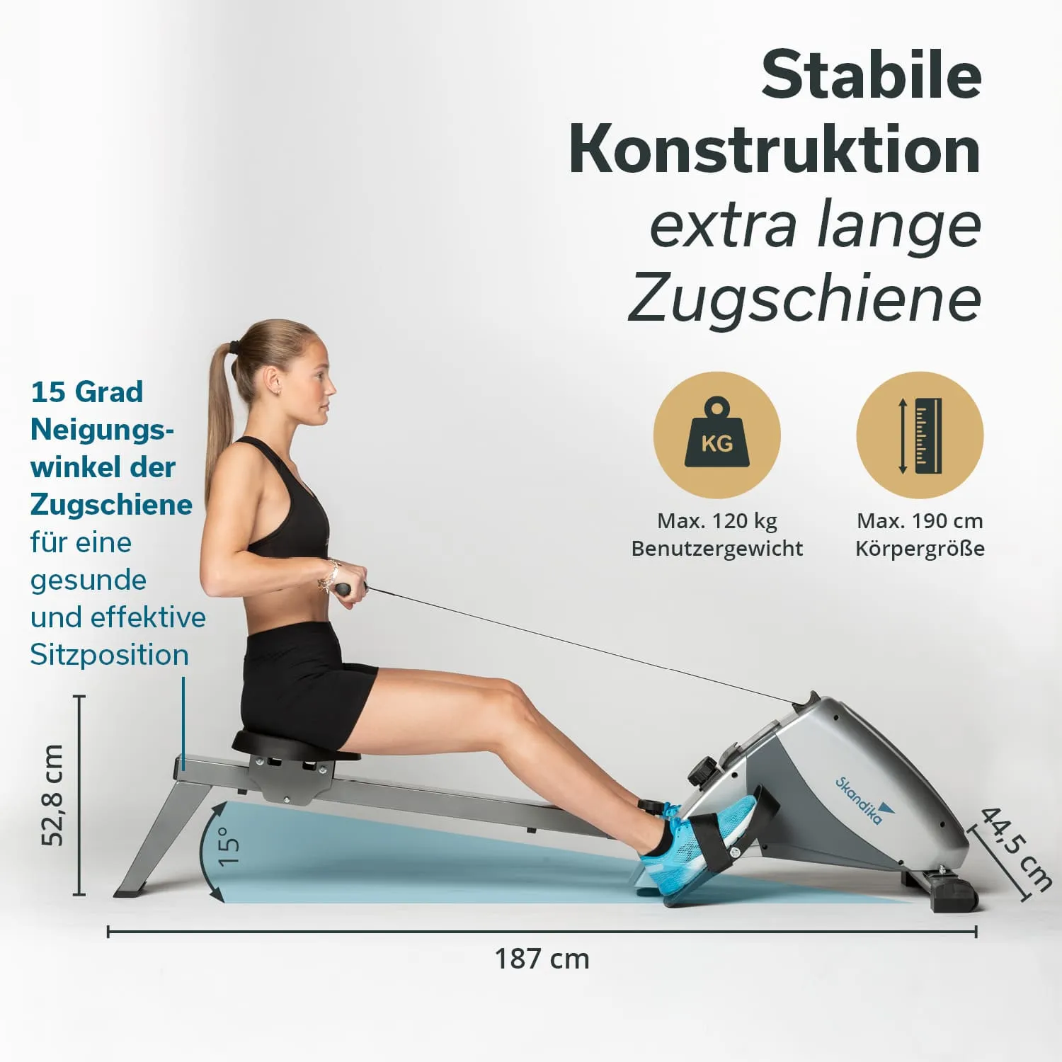 Rudermaschine mit stabiler Konstruktion und extralanger Zugschiene. Person in Trainingskleidung nutzt das Gerät. Maße sind angegeben.