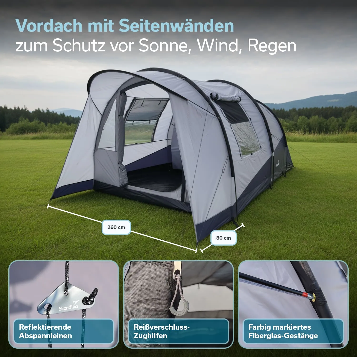 Vordach mit Seitenwänden in Grau mit Maßen und Details zu Abspannleinen und Gestänge auf grünem Gras.