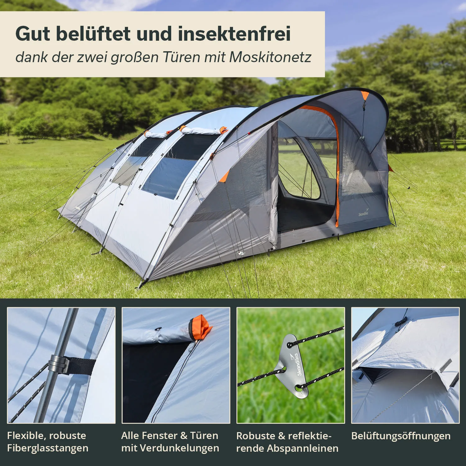 Zelt mit zwei großen Türen und Moskitonetzen, auf einer Wiese. Fenster und Türen sind mit Verdunkelungen ausgestattet.