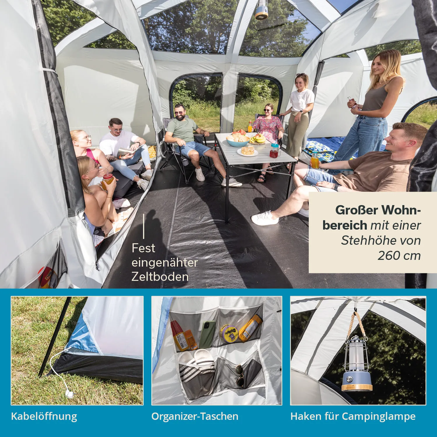Zelt mit großem Wohnbereich, Tisch und Stühlen, umgeben von Personen. Zubehör wie Organizer-Taschen und Haken sichtbar.