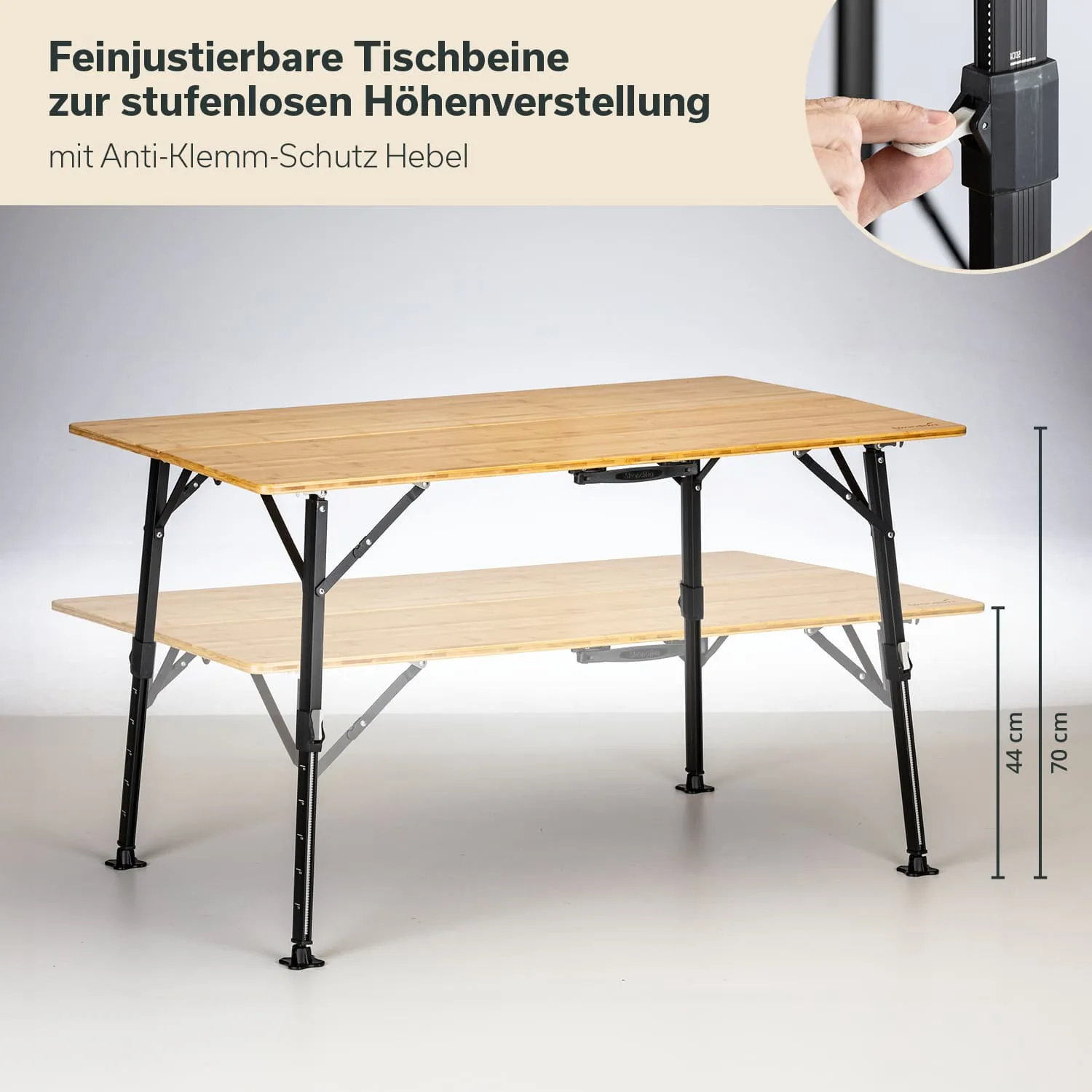Faltbarer Tisch mit zwei Ebenen und verstellbaren Tischbeinen. Über dem Tisch sind Maße von 44 cm und 70 cm sichtbar.