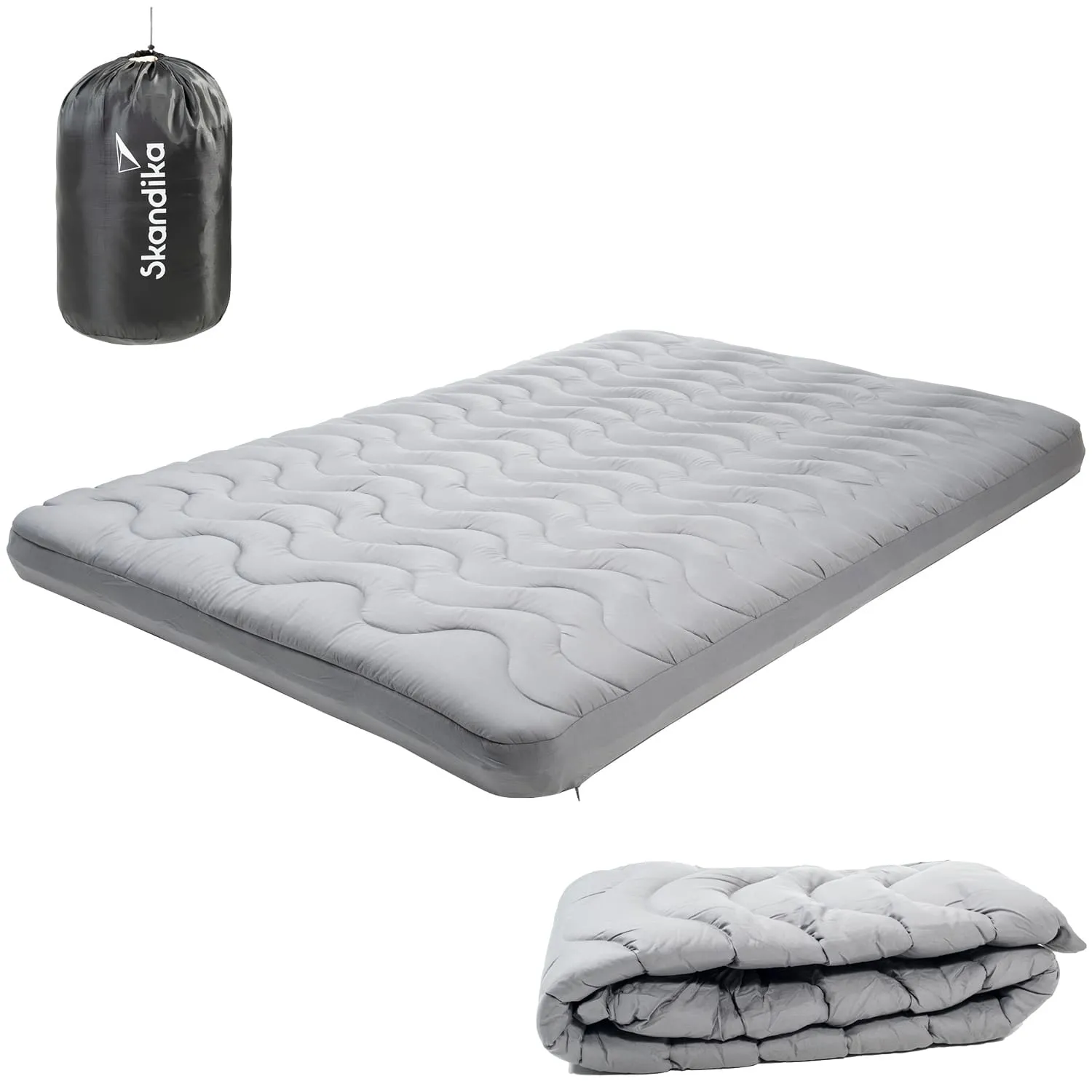 Matratze in Grau mit gewelltem Design, zusammengefaltet rechts unten, und einem schwarzen Tragetasche oben links.