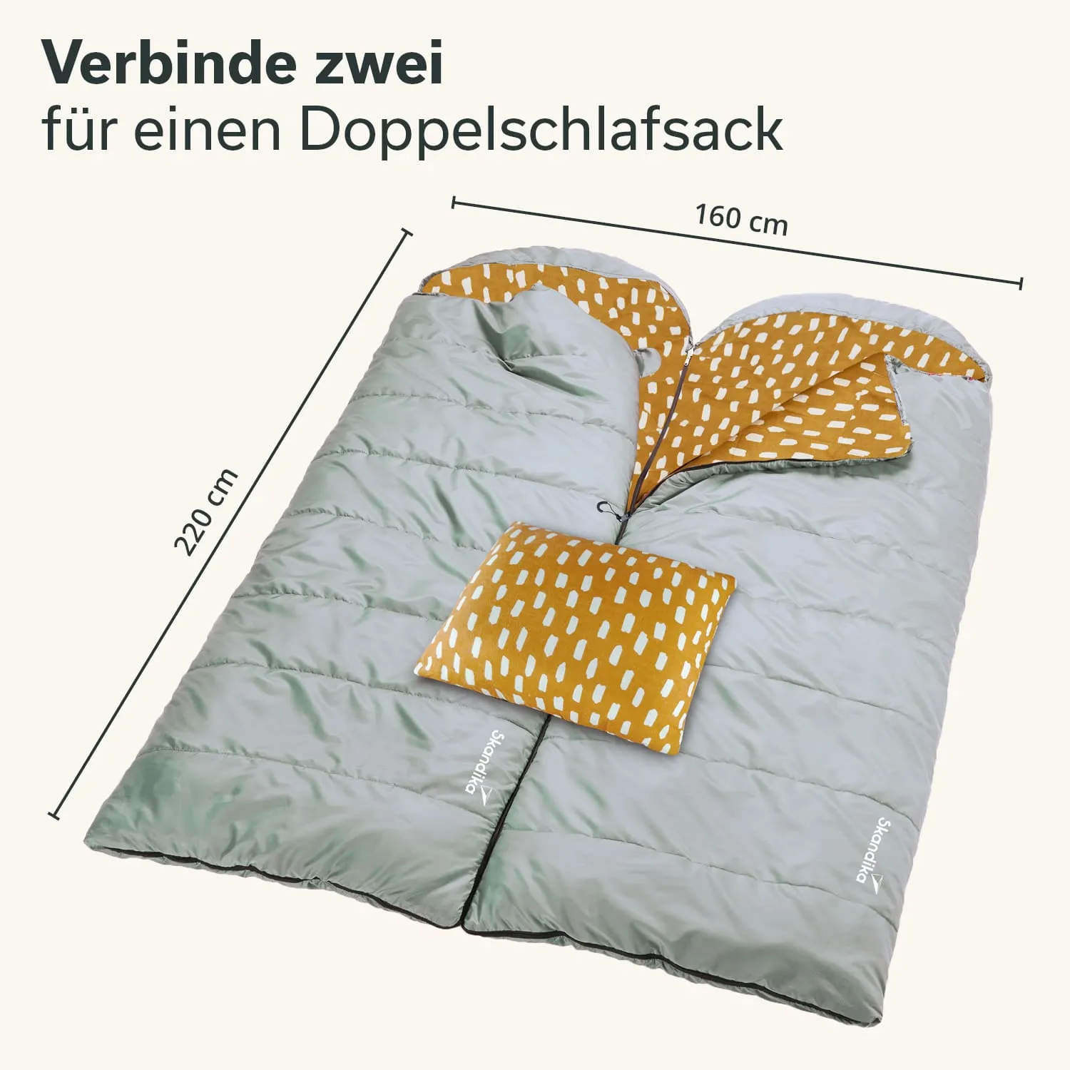 Doppelschlafsack in grau mit orangefarbenem gepunktetem Innenfutter und Kissen, Maße: 220 cm x 160 cm.