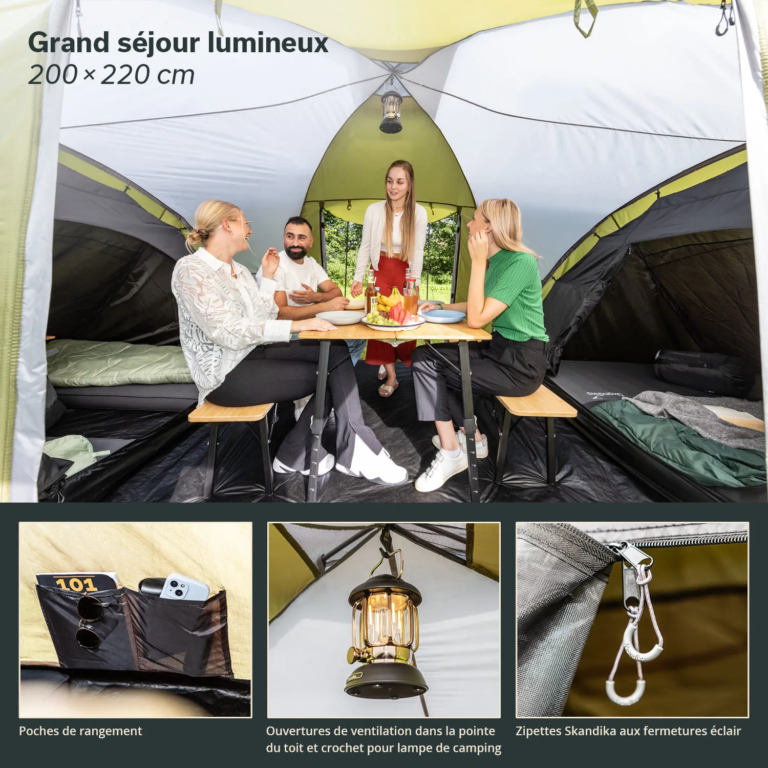 Innenansicht eines Zeltes mit vier Personen an einem Tisch, umgeben von Campingausstattung. Es gibt eine Hängeleuchte und Stauraum-Taschen.