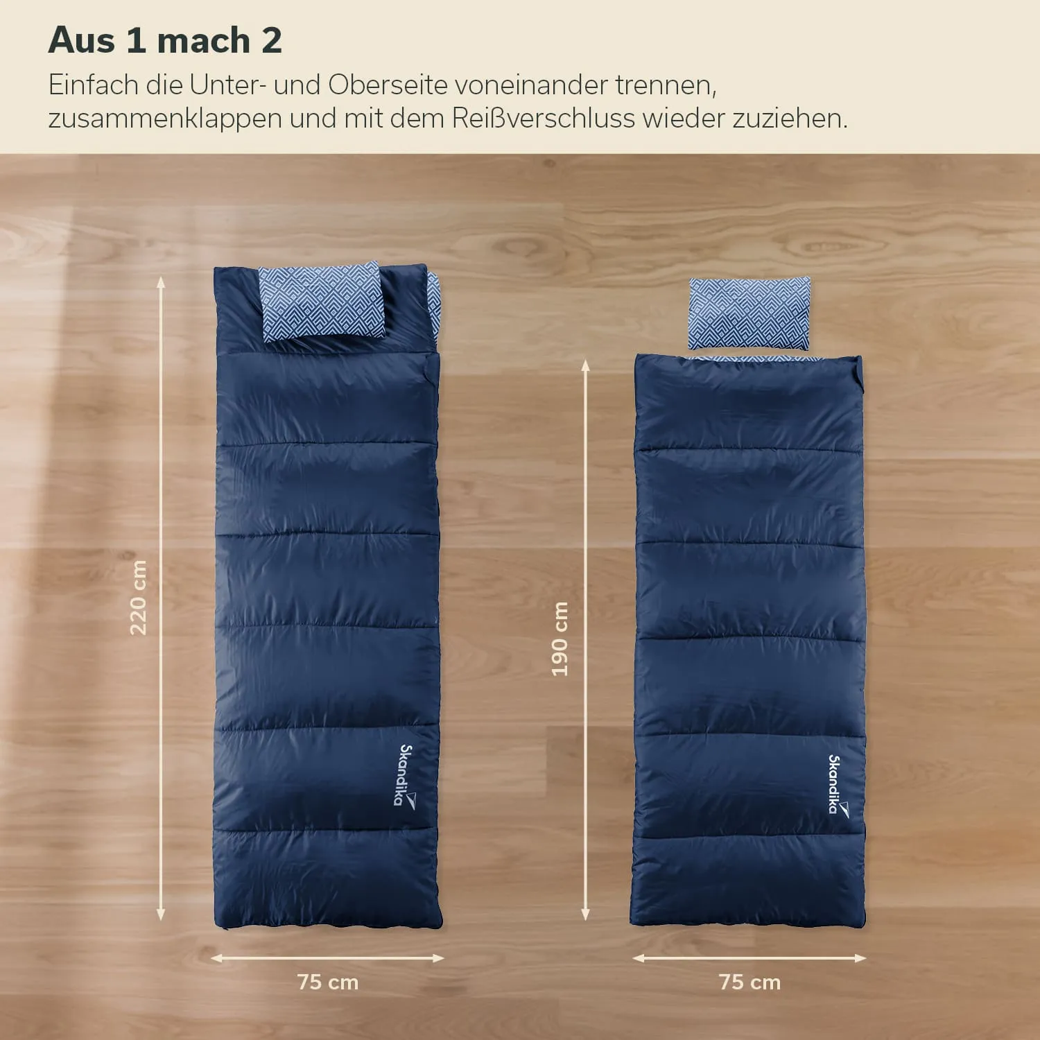 Zwei Schlafsäcke in Blau auf Holzuntergrund, einer 220 cm und der andere 190 cm lang, mit Kopfteil in gemusterter Stoffoptik.