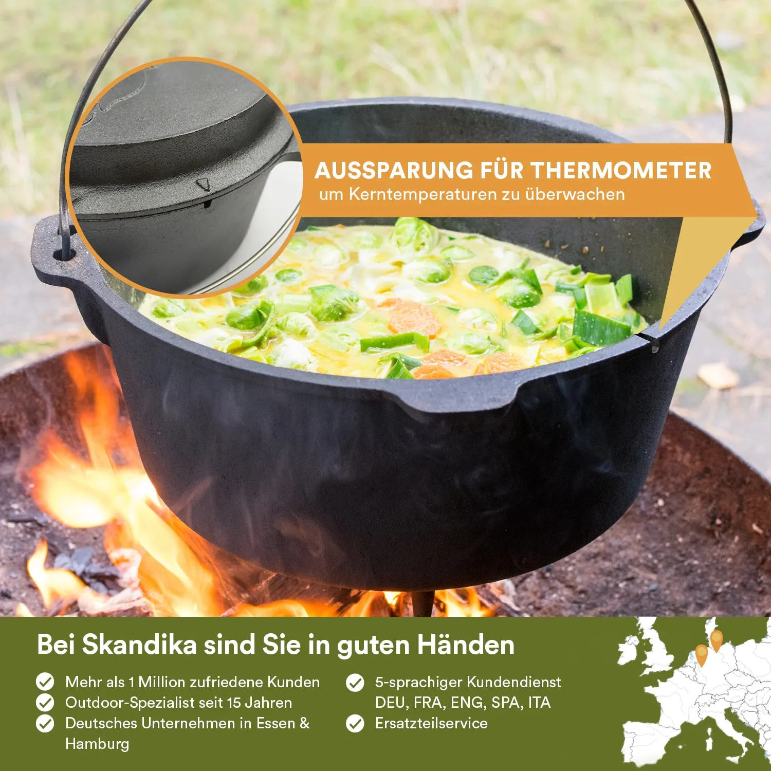 Schwarzer Gusseisenkochtopf auf einem Feuer mit Gemüse und Flüssigkeit. Temperaturmesserkontur sichtbar.