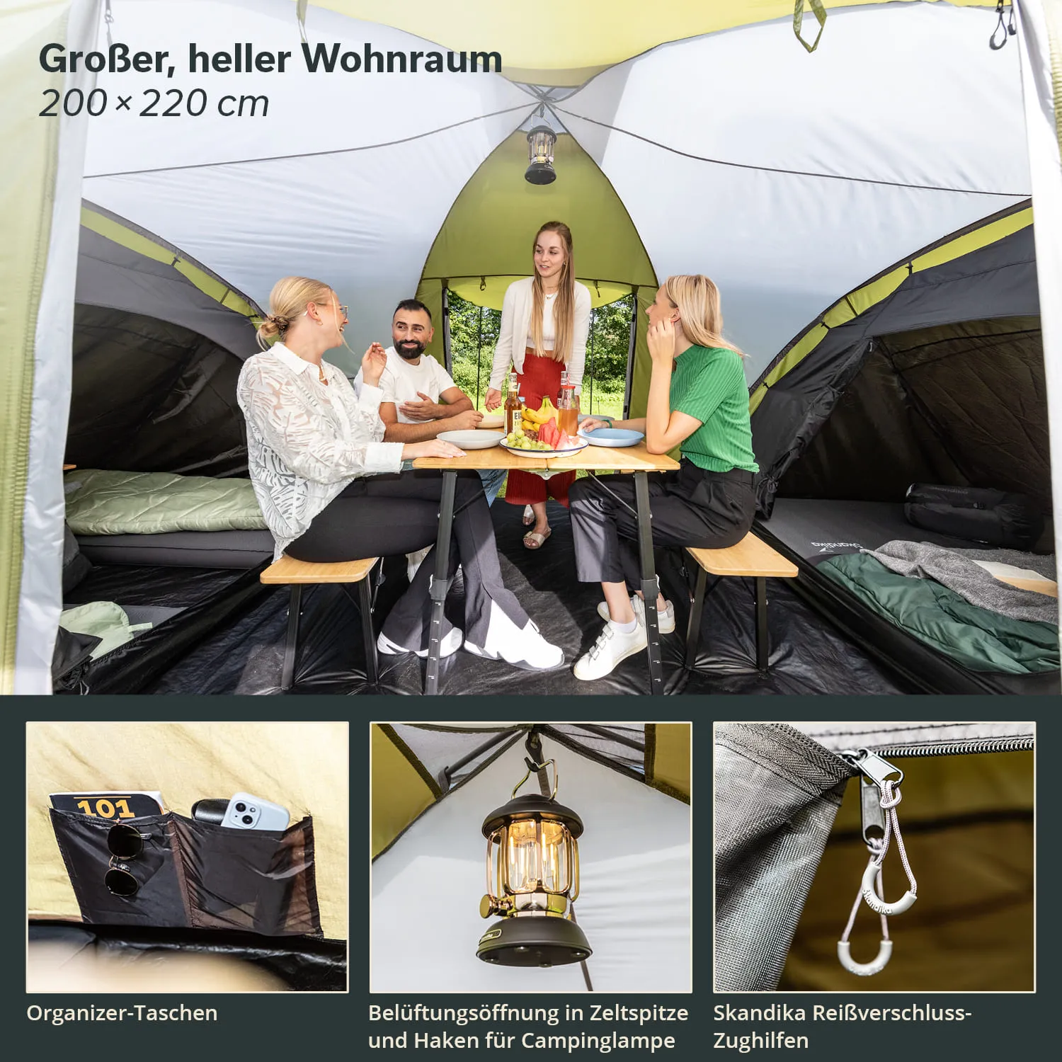 Im Zelt sitzen vier Personen an einem Tisch. Der Innenraum ist hell und geräumig, mit einem Tisch, Stühlen und Taschen. Oben hängt eine Lampe. Am Zeltboden sind Schlafmöglichkeiten erkennbar.