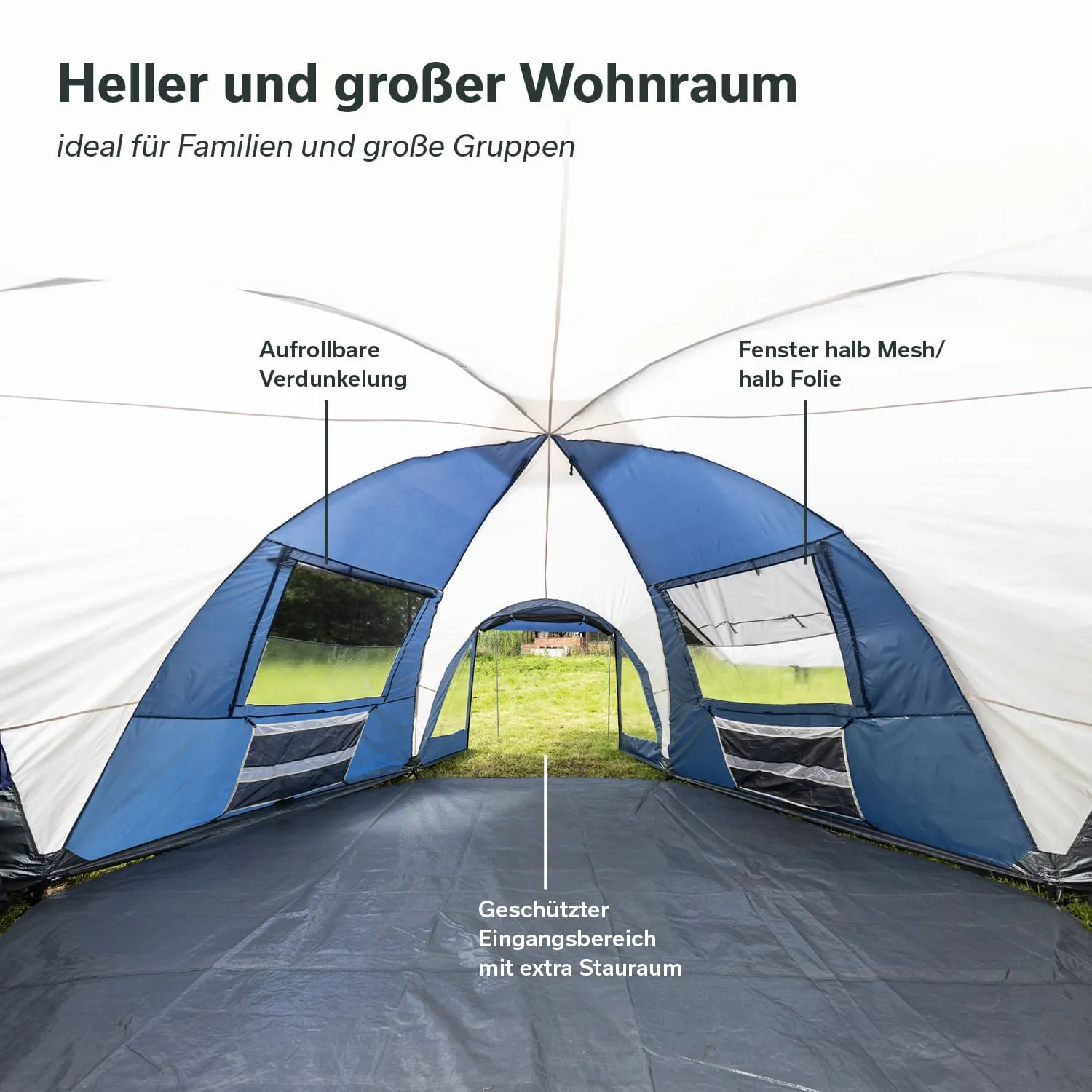 Geräumiges Zeltinnere mit blauen und weißen Wänden, Fenster sowie einem geschützten Eingangsbereich.