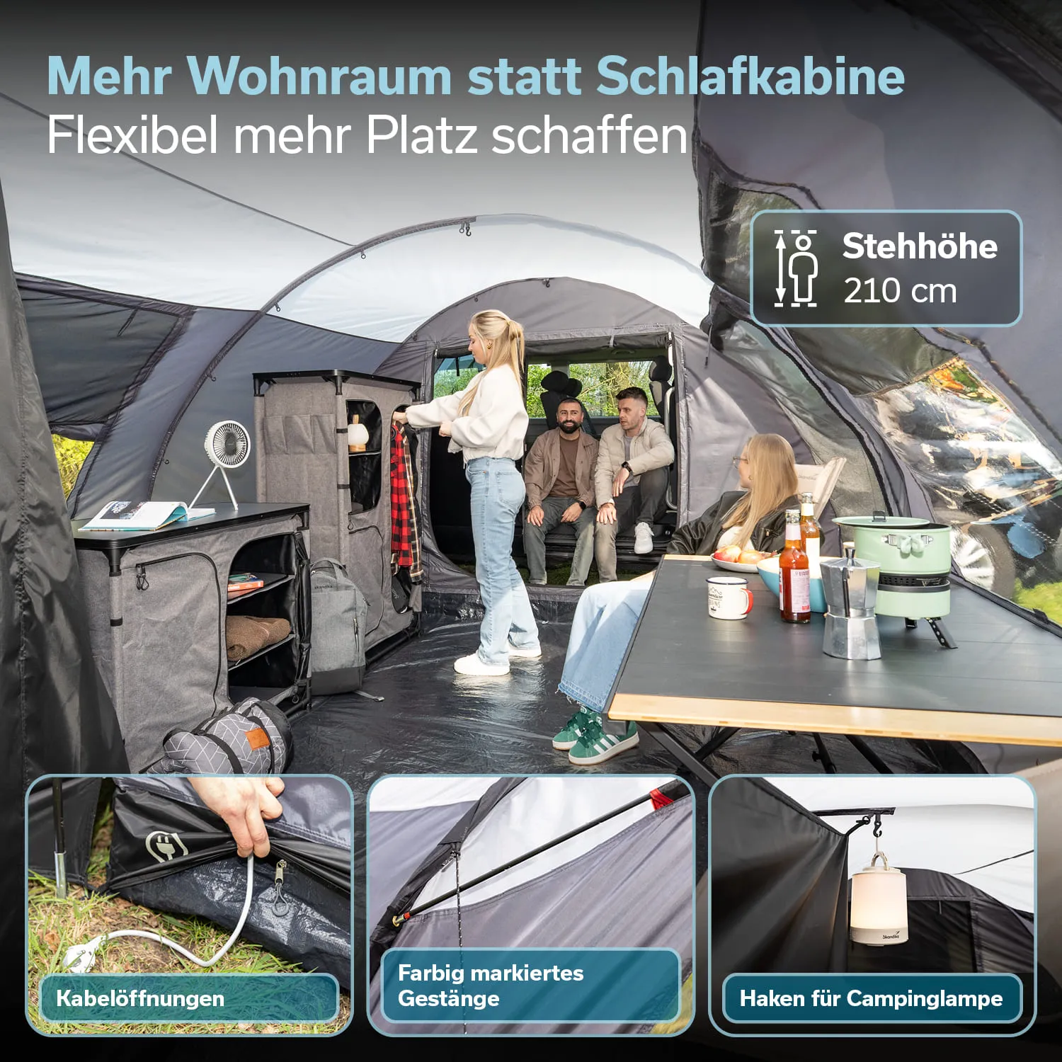 Eine geräumige Zeltinnensicht mit zwei Personen an einem Tisch, einer Person am Regal und zwei weiteren im Hintergrund.