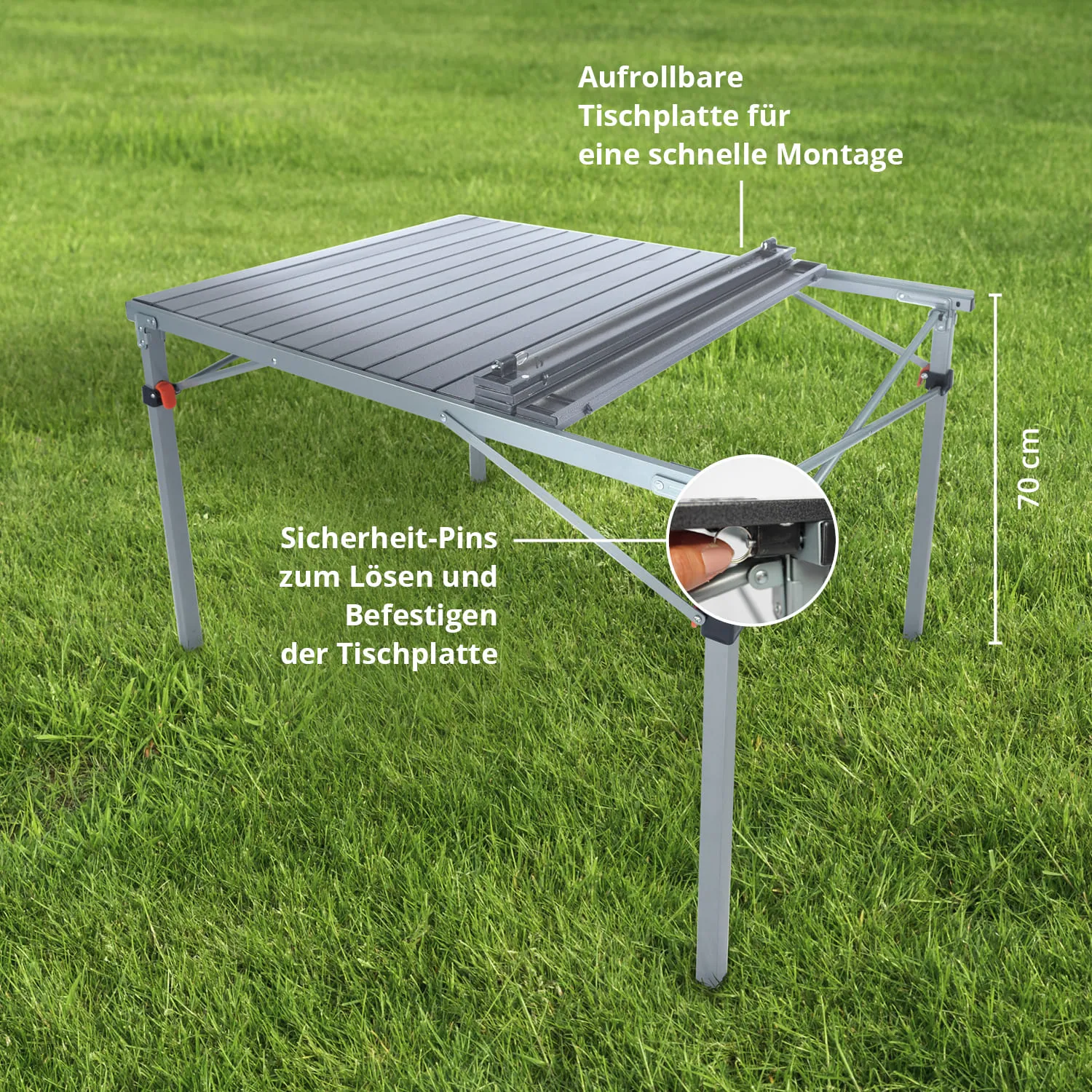 Faltbarer Tisch aus Aluminium mit aufrollbarer Tischplatte und Sicherheit-Pins, auf Grasfläche. Höhe 70 cm.
