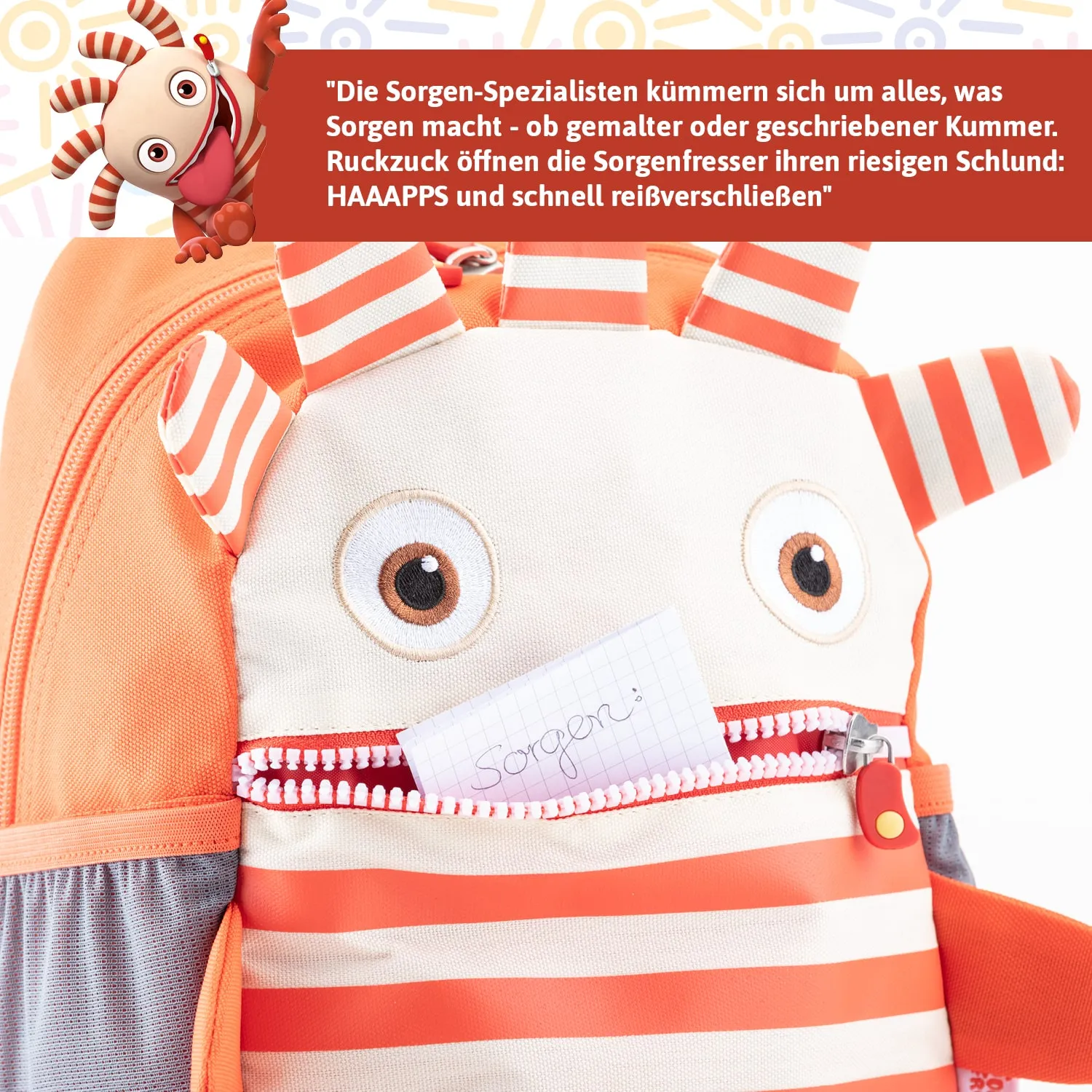 Rucksack in Orange und Beige mit Tiermotiv. Offene Tasche zeigt einen Zettel mit der Aufschrift „Sorgen“.