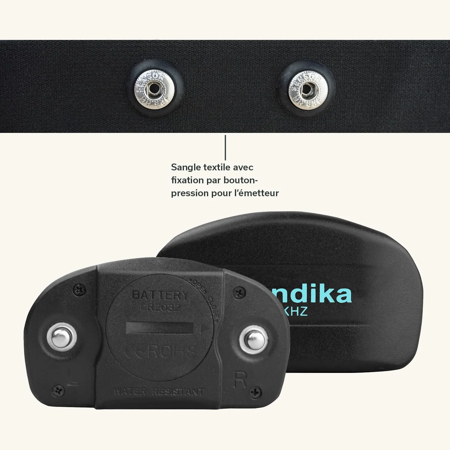 Textilschnalle mit Druckknopf und einem schwarzen Gerät, das die Aufschrift "Mandika" und Symbole für Batterie und Wasserfestigkeit zeigt.