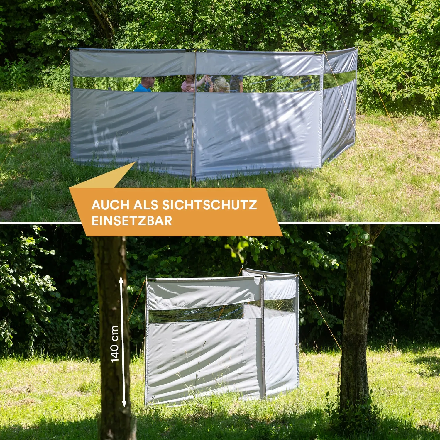 Faltbarer Sichtschutz aus grauem Material in einer grünen Wiese, teilweise umgeben von Bäumen. Sichtfenster in mehreren Bereichen.