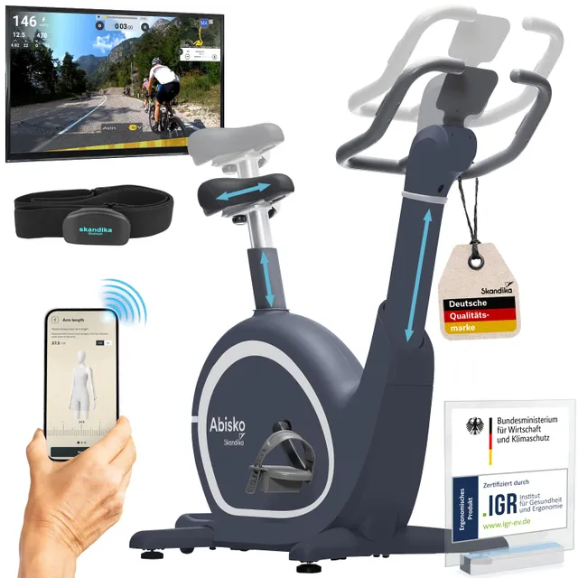 Hometrainer mit einem Bildschirm, Smartphone und einem Sensorband. Der Bildschirm zeigt eine Radfahransicht.