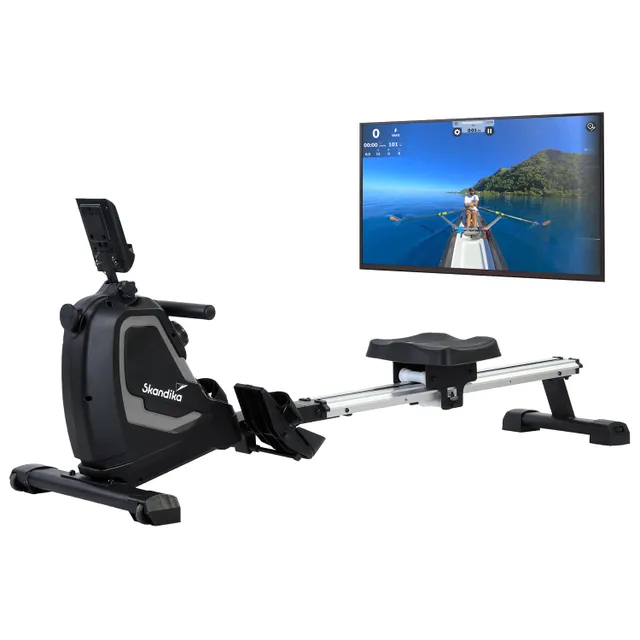 Rudergerät mit Display in Schwarz und Silber, daneben ein Monitor mit einer Landschaft auf dem Wasser.