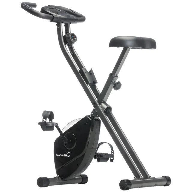Faltbares Ergometer mit schwarzem Rahmen, Sitz und Pedalen. Anzeigeinstrument an der Haltestange.