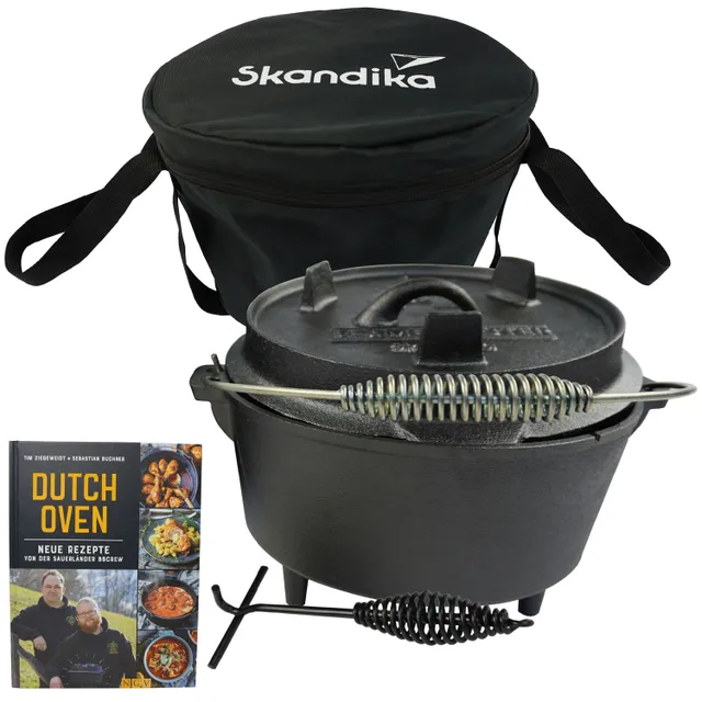 Dutch Oven aus Gusseisen mit Deckel, neben einer schwarzen Tragetasche und einem Rezeptbuch mit dem Titel "Dutch Oven".