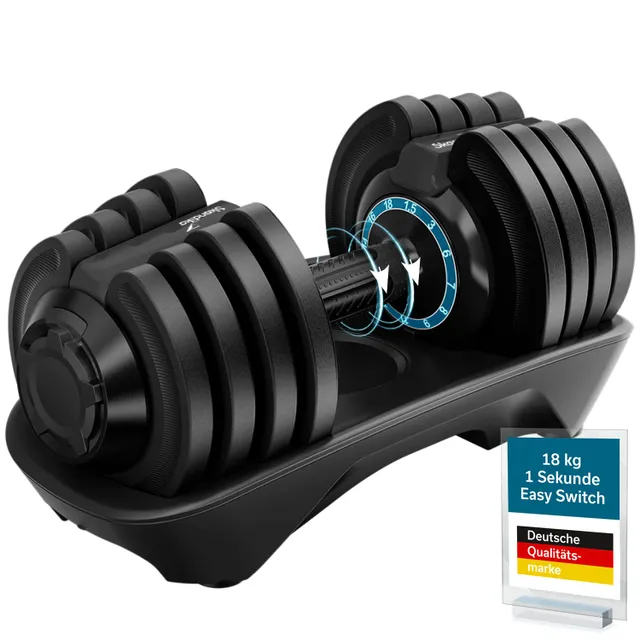 Verstellbare Hantel mit Griff, auf einer Basis. Markierungen für Gewichtseinstellungen sind sichtbar.